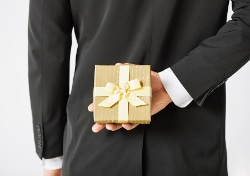 close up of man hands holding gift box